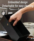 Heavy Duty Espresso Knock Box With Dedicated Tamper Dock Solid Wood Grind Catch Cup No Sweat Dosing Tray For A Clean Home Barista Kitchen Counter Setup, person lifting detachable black box