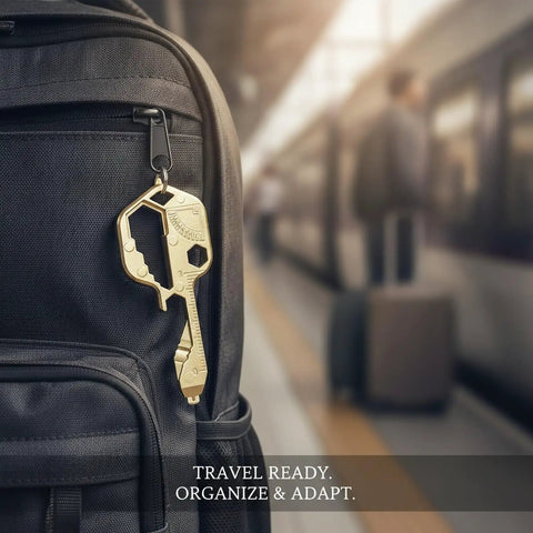 Compact Keychain Multitool for Quick On-The-Go Adjustments attached to backpack at train station, gold finish