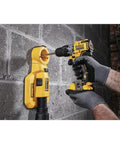Hand holding 12V Max XR Hammer Drill Bare Tool, ultracompact and lightweight for quick home projects, drilling into a wall