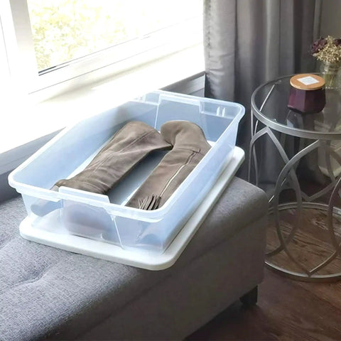 4 Pack SnapLock Clear Plastic Storage Bins With Lids 28-Quart Stackable Containers holding boots near bedroom window