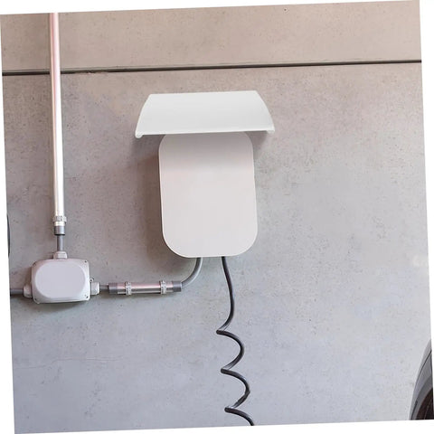 Heavy Duty Outdoor EV Charger Enclosure Weatherproof Rain Shell For Your Electric Vehicle Plug With Rock Solid UV Guard and Super Quick Install Housing Box For Built Tough Longevity mounted on wall with charging cable.