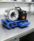 Heavy Duty Portable Electric Hydraulic Hose Crimping Machine With Eight Precision Dies And Forty Mpa Pressure For Rig Ready Automotive Repair And No Fuss Farm Shop Builds Aluminum Frame, side view on workbench.