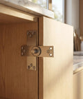 Stainless Steel Concealed Pivot Hinge Delivering Smooth As Butter 360 Rotation For Cabinets, close-up view of installation on cabinet.