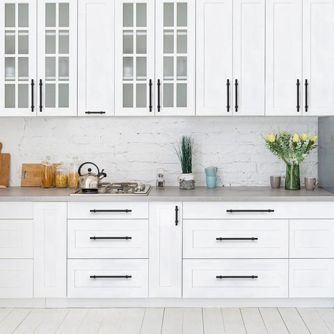 Matte Black 25 Pack Cabinet Handles 3 Inch Hole Centers 5 Inch Overall Length installed on white kitchen cabinets
