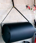 Tow Behind Lawn Roller 690 Lb Capacity With Easy Turn Plug, 36 Inch Wide Poly Drum in flat black finish stored in a garage