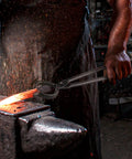 Blacksmith using Heavy Duty Blacksmith Tongs Set With Four Jaw Styles V Bit Bolt Wolf Jaw Z V Bit And Gripping Tongs on hot metal.