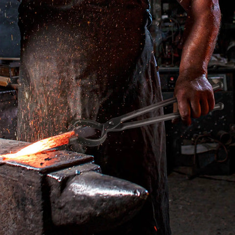 Blacksmith using Heavy Duty Blacksmith Tongs Set With Four Jaw Styles V Bit Bolt Wolf Jaw Z V Bit And Gripping Tongs on hot metal.