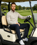 Man wearing Mens Quarter Zip Performance Pullover For Golf And Everyday Wear in golf cart, showing heather stripe design.