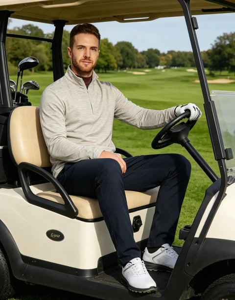 Man wearing Mens Quarter Zip Performance Pullover For Golf And Everyday Wear in golf cart, showing heather stripe design.