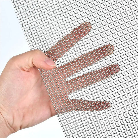 Hand holding 4 Pack Stainless Steel Wire Mesh Sheets 12 By 8 Inches For DIY Projects No Rust Easy To Cut Durable As Heck And Ready For Pro Grade Craft Screen Mesh Set