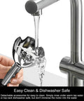 Titanium-Reinforced 3-In-1 Immersion Hand Blender With Copper Motor being rinsed under faucet, showing easy cleaning feature