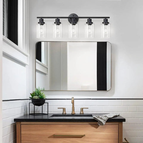 Slick Black 5 Light Vanity Fixture With Clear Glass Shades mounted above mirror in bathroom, E26 Base, sleek contemporary lighting