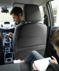 Anti Kick Seat Back Protector For Tesla Cybertruck 2023 And 2024 with faux leather panel in vehicle rear seat with passengers.