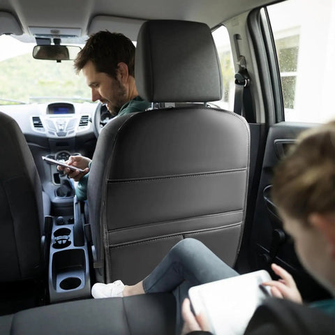 Anti Kick Seat Back Protector For Tesla Cybertruck 2023 And 2024 with faux leather panel in vehicle rear seat with passengers.