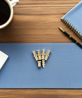 Metal Table Pins And Dowels Set For Furniture Joints And Desk on wooden table with blue mat, cup, pen, and notebook