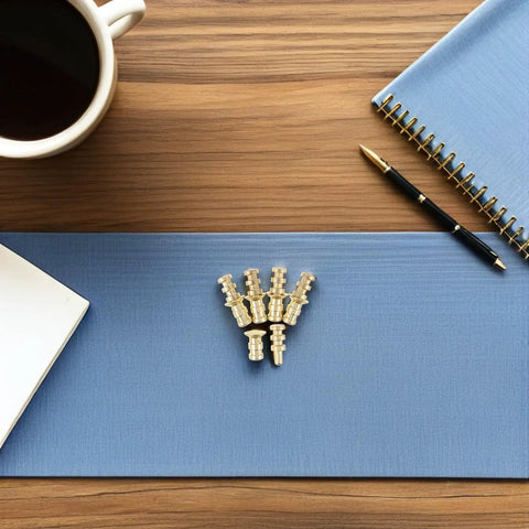 Metal Table Pins And Dowels Set For Furniture Joints And Desk on wooden table with blue mat, cup, pen, and notebook