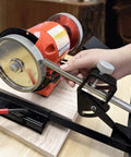 Heavy Duty Woodturning And Carving Tool Sharpening Jig For 6 Inch To 8 Inch Bench Grinders mounted on a workbench with grinding wheel.