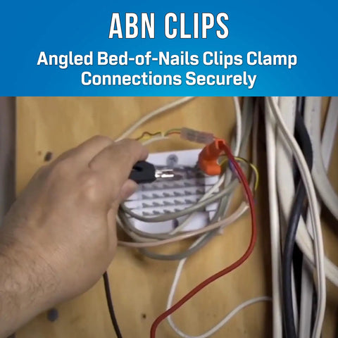 Hand using Go To Analog Telephone Line Tester Butt Set With ABN Clips for dial tone testing and line troubleshooting.