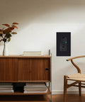 Heavy Duty Black GFCI Outlet 15 Amp Top Shelf GFI Electrical Receptacle mounted on a wall next to a wooden cabinet and chair.