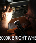 Person using 2 Pack LED Flashlight Replacement Bulbs PR2 P13.5S 3W 247LM for precise work under bright light.