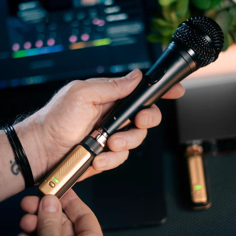 Person holding Spark Link XLR Wireless System For Dynamic Microphones Pro Grade Studio Audio With 24Bit 48kHz 96dB Dynamic Range