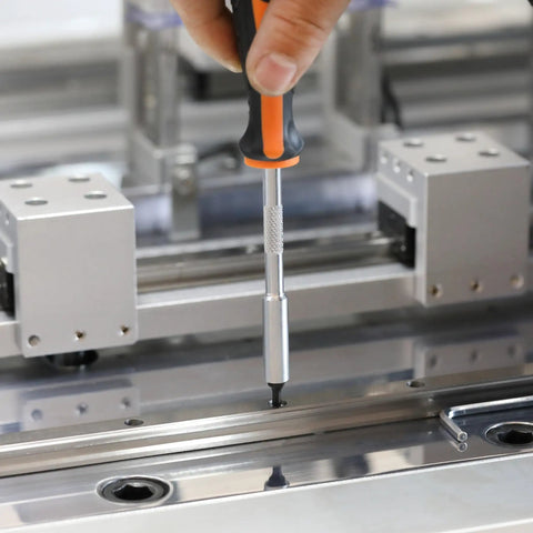 Using Tamper Proof Torx Bit Set 14-Piece T4 Through T40 with 1/4 Inch Ergonomic Magnetic Bit Driver on a metal surface