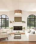 18 Inch Plug In Rattan Pendant Light With Premium Linen Shade Boho Ceiling Chandelier over a cozy living room setting.