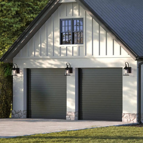 Conover Outdoor Lantern in Antique Pewter Finish illuminating garage exterior, weatherproof porch light for curb appeal and safe night lighting