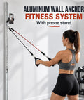 Wall Mounted Fitness Anchor System With Heavy Duty Resistance Band Mount And 40 Inch Dual Rail Setup For Compact Home Gyms in use.
