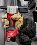 Worker using M12 Cordless Rivet Tool Kit for No Fuss Riveting on Aluminum, Steel And Stainless Rivets in outdoor setting