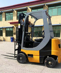 Four Wheel Electric Forklift Battery Powered Material Handler Heavy Duty Workhorse Built To Crush Weight With A Smooth Rolling Planetary Axle System, side view in an outdoor setting.