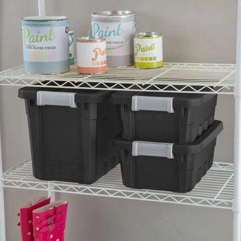 Two black Six Pack Seven Point Five Gallon Stackable Tote For Home Organization Tough Plastic Storage Bins on shelf with paint cans