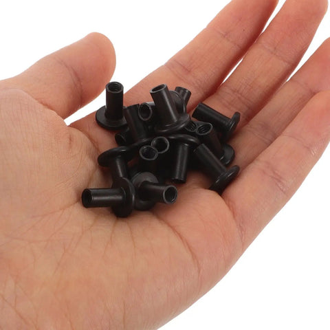 Hand holding Socket Cap Bolts Set In Black Iron With Round Button Heads And Internal Socket Design For Quick Tightening And Rock Solid Connections In Furniture And Hardware Projects 20 Pieces