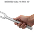 Hand holding a 15 16 Inch Ball Joint Separator Pickle Fork Tool Tie Rod Tool Heavy Duty Steel with a long knurled handle for grip.