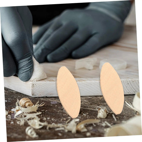 Quality Wood Biscuit Joiner Plates For Sturdy Furniture Assembly heavy duty slotting blocks on wood surface with wood shavings.
