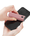 Touchscreen Mist Cleaner Kit With Spray And Wipe Pink Pocket Size Screen Cleaner for iPhone and Android shown in use