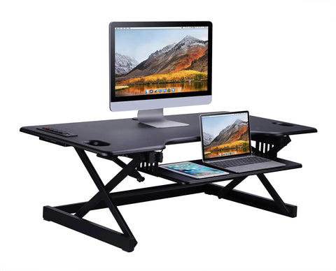 46 Inch Height Adjustable Standing Desk Converter With USB Charger And Anti Fatigue Mat for sit-stand setup, holding monitors.
