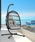 Egg Chair With Stand For Patio And Garden, Wicker Rattan Hanging Swing Hammock Seat overlooking ocean on balcony