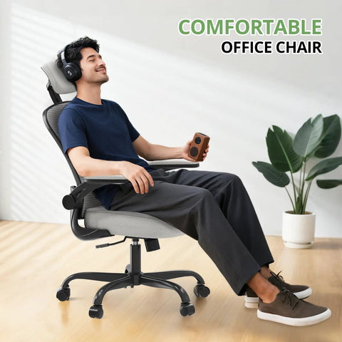 Man relaxing on ergonomic office chair for long hours, boss level comfort high back desk chair with adjustable headrest and lumbar support.