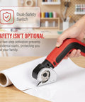 Kitluck Cordless Electric Scissors With Rechargeable Battery And Replacement Blade in use, showcasing dual-safety switch design for safe cutting.