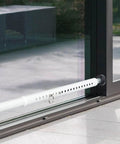 Adjustable Sliding Door Security Bar 17 To 51 Inches For Patio Doors And Windows, installed at bottom of glass door, white finish.