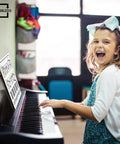 Child using 11 By 14 Inch Keyboard Practice Dry Erase Lapboard Double Sided Music Staff Whiteboard For Kids Students Musicians