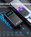 All-In-One Portable Car Jump Starter With Air Compressor, 6000A Jump Box charging a phone, showing digital display