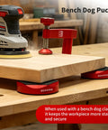 Ironclad Bench Dog Clamp Pack For Mft Workbenches With Ten Nonslip Inserts, showing clamps securing a wood piece for sanding.