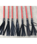 No Sweat Heavy Duty Red Rubber Fire Mop Broom With Long Poplar Wood Handle, seven fire mops lined up with black rubber strips.