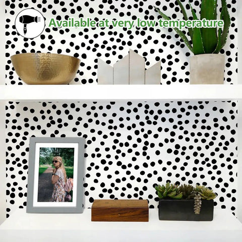 Easy Peel And Stick Black Polka Dot Wallpaper Roll No Mess Install 17.7 By 393.7 Inches Covers 48.4 Sq Ft Breezy Removable Self Adhesive Vinyl for Walls Bathroom And Living Space Decor displayed on shelf with decor items.