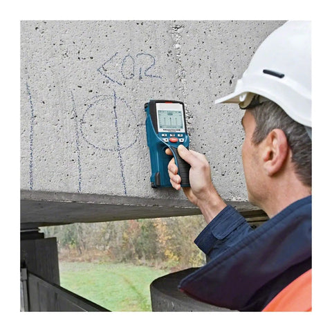 Heavy Duty Handheld Wall Scanner And Stud Detector Real Workhorse Multi Function Finder For Wood Studs Live Wires Steel Bars Water Pipes Plus Bullseye Center Locator Tool in use on concrete surface