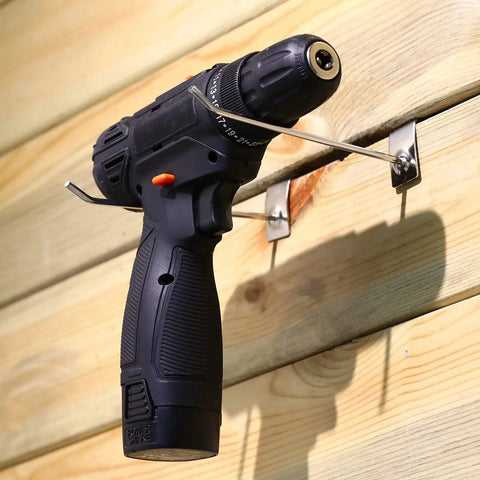 100 Pack Slatwall Hooks 6 And 8 Inch Silver Metal Pegs for Garage Shop Retail Display holding a drill on wooden panel