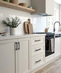 10 Pack Matte Black Solid Cabinet Pulls 5 Inch Center to Center installed on white kitchen cabinets with zinc alloy construction