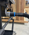 Close-up of a One Seven Eight Inch Hose Adapter For Two And One Quarter Inch Table Saw Dust Ports With Quick Twist Lock compatible with Dewalt Milwaukee and Ridgid saws installed on a table saw.
